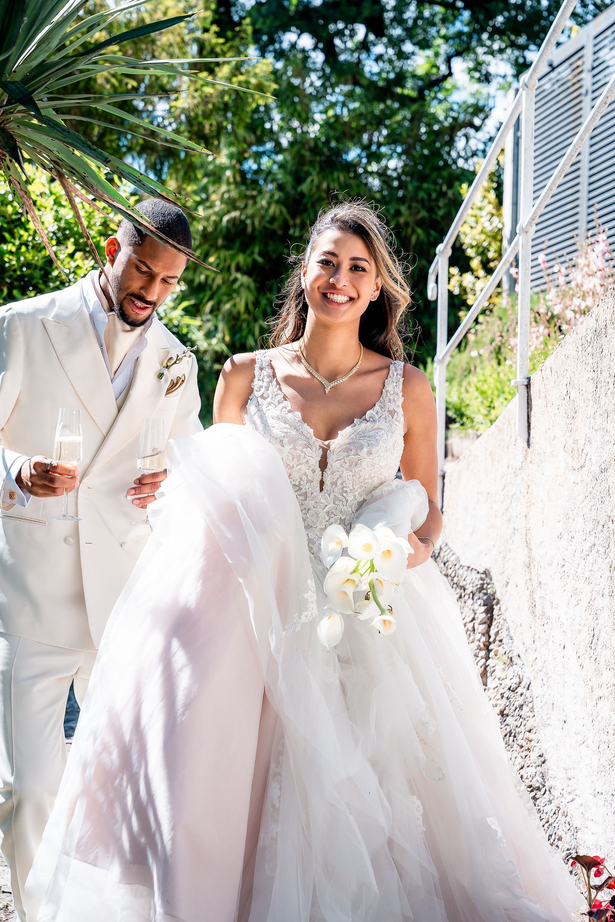 Sarina and Joshua walking between portraits