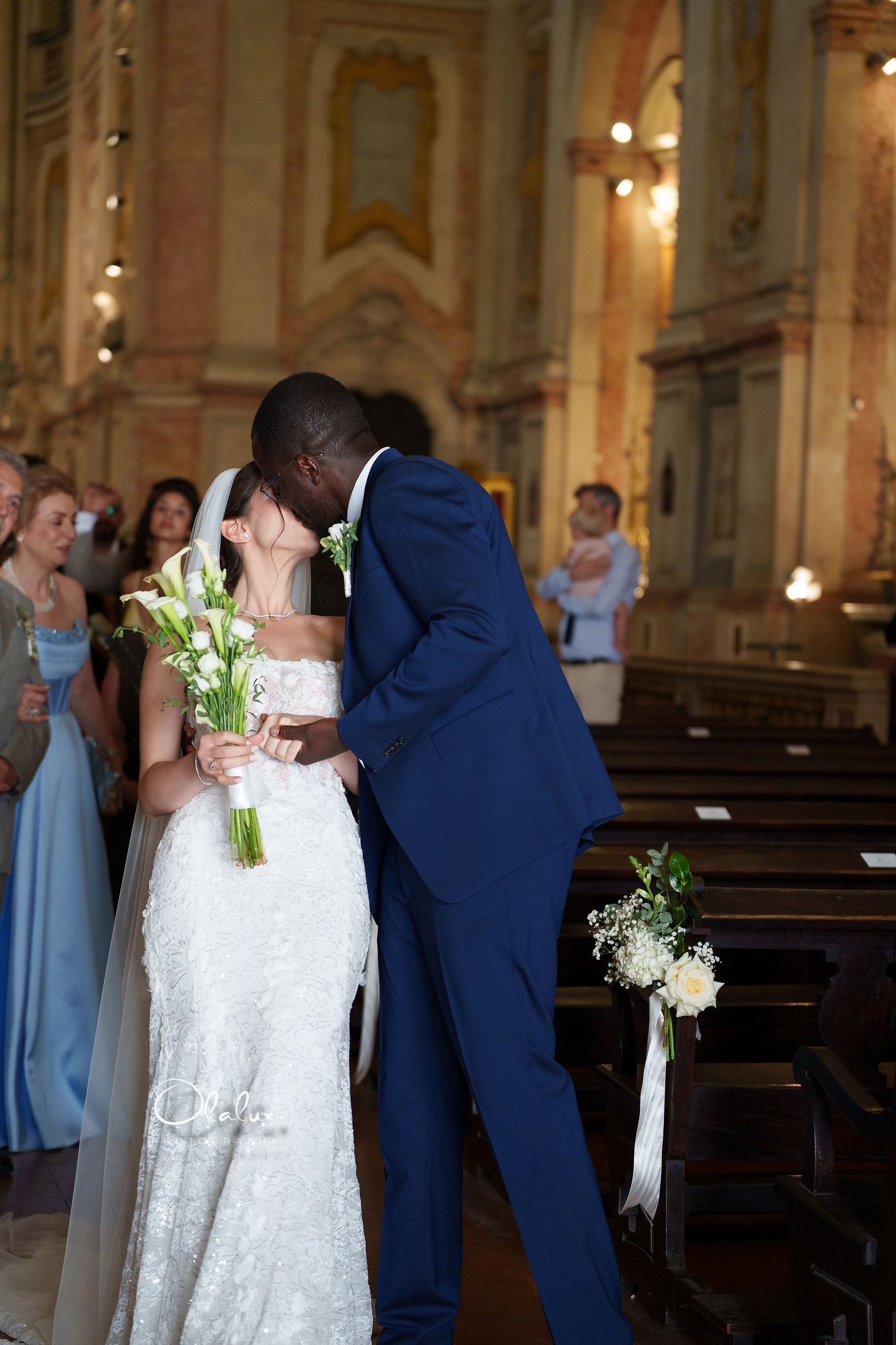 A church kiss during Angela and Femi’s ceremony