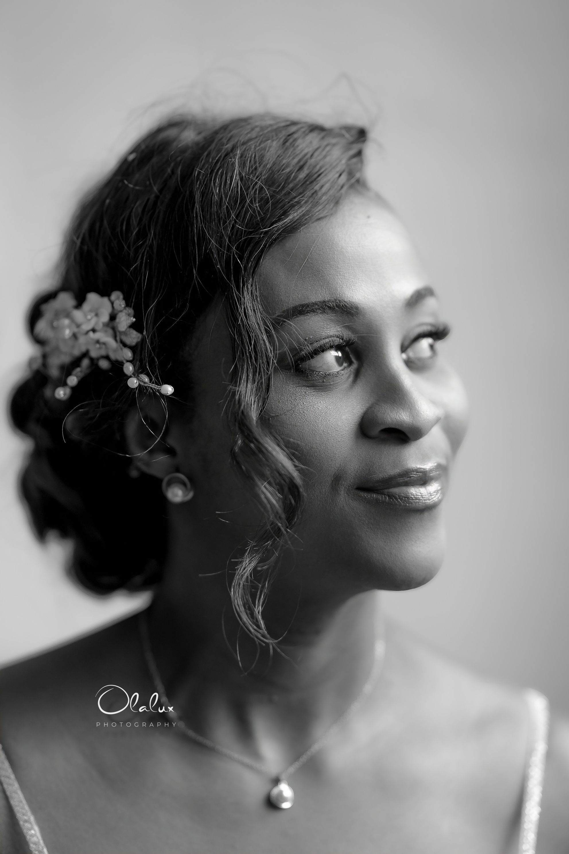 A black-and-white bridal portrait